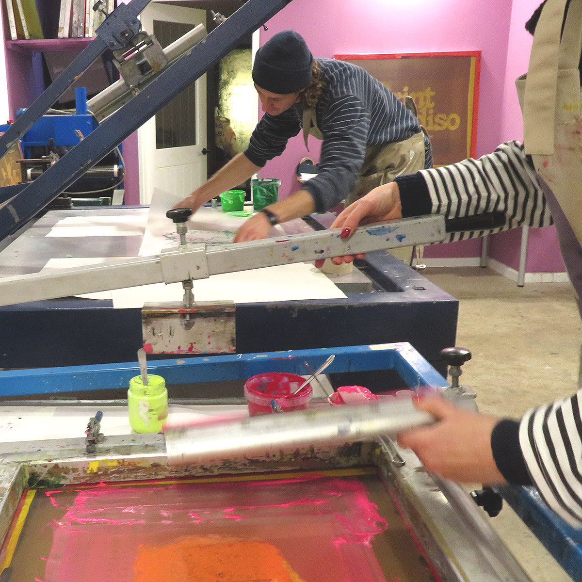 Two printers using vacuum tables printing on paper